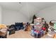 Attic with storage bins and various items, providing additional storage space at 3805 Carder Ln, Cumming, GA 30028