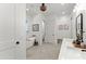 Bright bathroom featuring a modern soaking tub, dual vanity and stylish finishes at 3805 Carder Ln, Cumming, GA 30028