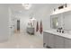 Elegant bathroom with double vanity, marble countertops, and tiled floor at 3805 Carder Ln, Cumming, GA 30028
