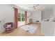 Bright bedroom with wood floor, ceiling fan, large window, and colorful rug at 3805 Carder Ln, Cumming, GA 30028