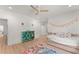 Bright bedroom with a ceiling fan, decor, and a daybed with a plush comforter at 3805 Carder Ln, Cumming, GA 30028