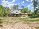 Lovely home with a covered porch, patio furniture, and a serene backyard at 3805 Carder Ln, Cumming, GA 30028