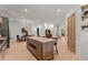 Open concept kitchen with a large island, stainless steel appliances, and wood-burning oven at 3805 Carder Ln, Cumming, GA 30028
