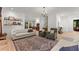 Spacious living room showcasing hardwood floors, a cozy seating area, and elegant decor at 3805 Carder Ln, Cumming, GA 30028