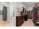 Spacious walk-in closet with custom storage solutions and lots of hanging storage at 3805 Carder Ln, Cumming, GA 30028