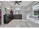 Luxurious bathroom featuring a soaking tub, a glass-enclosed shower, and double vanities at 4550 Lois Se St, Smyrna, GA 30080