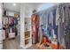 Walk-in closet with built-in shelving, filled with clothes and accessories, provides ample storage at 4550 Lois Se St, Smyrna, GA 30080