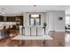Open-concept dining area with a modern chandelier, ample seating, and seamless flow to the kitchen and living spaces at 4550 Lois Se St, Smyrna, GA 30080