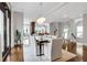 Inviting dining room featuring natural light, seating for eight, and direct access to outdoor patio at 4550 Lois Se St, Smyrna, GA 30080