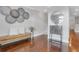 Bright entryway with hardwood floors, a modern console table, and an artistic wall decor to greet guests at 4550 Lois Se St, Smyrna, GA 30080