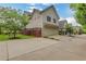 Home featuring a two-car garage, well-kept lawn, and a concrete driveway at 4550 Lois Se St, Smyrna, GA 30080