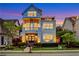 Charming three-story home boasts a welcoming front porch, second-floor balcony, and an additional top-floor balcony at 4550 Lois Se St, Smyrna, GA 30080