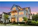 Attractive three-story home features a balcony on the second floor and a rooftop terrace for outdoor living at 4550 Lois Se St, Smyrna, GA 30080