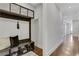 Hallway featuring built-in storage, bench, and hardwood floors at 4550 Lois Se St, Smyrna, GA 30080