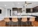 A chef's kitchen featuring stainless steel appliances, a spacious island, and barstool seating at 4550 Lois Se St, Smyrna, GA 30080