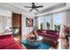 Comfortable living area featuring a fireplace, plush sofas, and large windows for a bright and airy atmosphere at 4550 Lois Se St, Smyrna, GA 30080