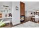 Bright living room showcasing a fireplace, built-in shelves, and an open floor plan at 4550 Lois Se St, Smyrna, GA 30080