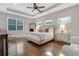 Serene main bedroom with tray ceiling, plush bedding, and ample natural light at 4550 Lois Se St, Smyrna, GA 30080