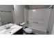 Standard bathroom with a sink, toilet, and shower-tub combination at 6231 Waterton Way, Lithonia, GA 30058