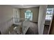 Upstairs hallway with staircase, natural light, and neutral carpet at 6231 Waterton Way, Lithonia, GA 30058