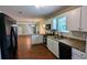 Modern kitchen featuring granite countertops, stainless steel appliances, and hardwood floors at 6231 Waterton Way, Lithonia, GA 30058