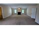 Bright living room with a fireplace and two windows, perfect for relaxation at 6231 Waterton Way, Lithonia, GA 30058