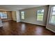 Spacious living room area featuring hardwood floors and plenty of natural light at 6231 Waterton Way, Lithonia, GA 30058