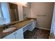 Main bathroom with dual sinks, granite counters, and separate tub and shower at 6231 Waterton Way, Lithonia, GA 30058