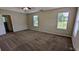 Main bedroom with carpet flooring, natural light, and ensuite bathroom at 6231 Waterton Way, Lithonia, GA 30058
