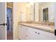 Bathroom featuring double sinks with granite countertops and a white vanity at 725 Heathland Dr, Roswell, GA 30075