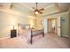 Warm and inviting bedroom with a decorative ceiling fan and neutral décor at 725 Heathland Dr, Roswell, GA 30075