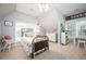 Bright bedroom with a ceiling fan, and a window with natural light at 725 Heathland Dr, Roswell, GA 30075