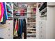 Walk-in closet featuring custom shelving and ample storage for clothes and shoes at 725 Heathland Dr, Roswell, GA 30075