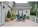 Cozy outdoor deck with a table and chairs, perfect for enjoying the surrounding greenery and fresh air at 725 Heathland Dr, Roswell, GA 30075