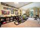 Spacious home gym features a variety of exercise equipment and memorabilia at 725 Heathland Dr, Roswell, GA 30075
