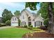 Attractive home with a well-manicured lawn and lovely landscaping, providing great curb appeal at 725 Heathland Dr, Roswell, GA 30075