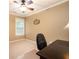 Neutral-toned office featuring a dark wood desk and a chair at 725 Heathland Dr, Roswell, GA 30075