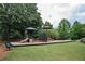 Community playground with slides, swings, and climbing structure, providing a fun and safe environment at 725 Heathland Dr, Roswell, GA 30075
