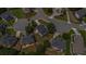 A nice neighborhood features well-maintained homes with mature trees and circular driveways at 2023 Arbor Springs Way, Buford, GA 30519
