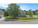 View of a brick two-story home with a green lawn and a two-car garage at 2023 Arbor Springs Way, Buford, GA 30519