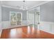Dining room featuring hardwood floors, wainscoting and lots of natural light at 2023 Arbor Springs Way, Buford, GA 30519
