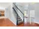 Bright foyer with staircase featuring wood floors and gray walls at 2023 Arbor Springs Way, Buford, GA 30519