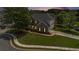 An aerial view of a beautiful home with a lush lawn and meticulously landscaped yard at 2023 Arbor Springs Way, Buford, GA 30519