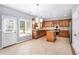 Kitchen with tile floors, a center island and stainless steel appliances at 2023 Arbor Springs Way, Buford, GA 30519