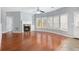 Living room with fireplace, hardwood floors and bright, natural light at 2023 Arbor Springs Way, Buford, GA 30519