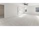 Spacious bedroom featuring neutral carpet, a ceiling fan, and natural light from a window at 2719 Byess Ct, Marietta, GA 30064