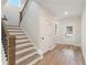 Bright entryway features hardwood floors and staircase with iron spindles at 2719 Byess Ct, Marietta, GA 30064
