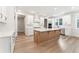 Spacious kitchen with wood floors, an island, and sleek white cabinets at 2719 Byess Ct, Marietta, GA 30064