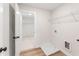 Well-lit laundry room with modern vinyl floors, shelving, and washer-dryer hookups at 2719 Byess Ct, Marietta, GA 30064