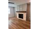 Cozy living room with a stone fireplace, wood mantle, and hardwood floors, offering a warm and inviting space at 2719 Byess Ct, Marietta, GA 30064